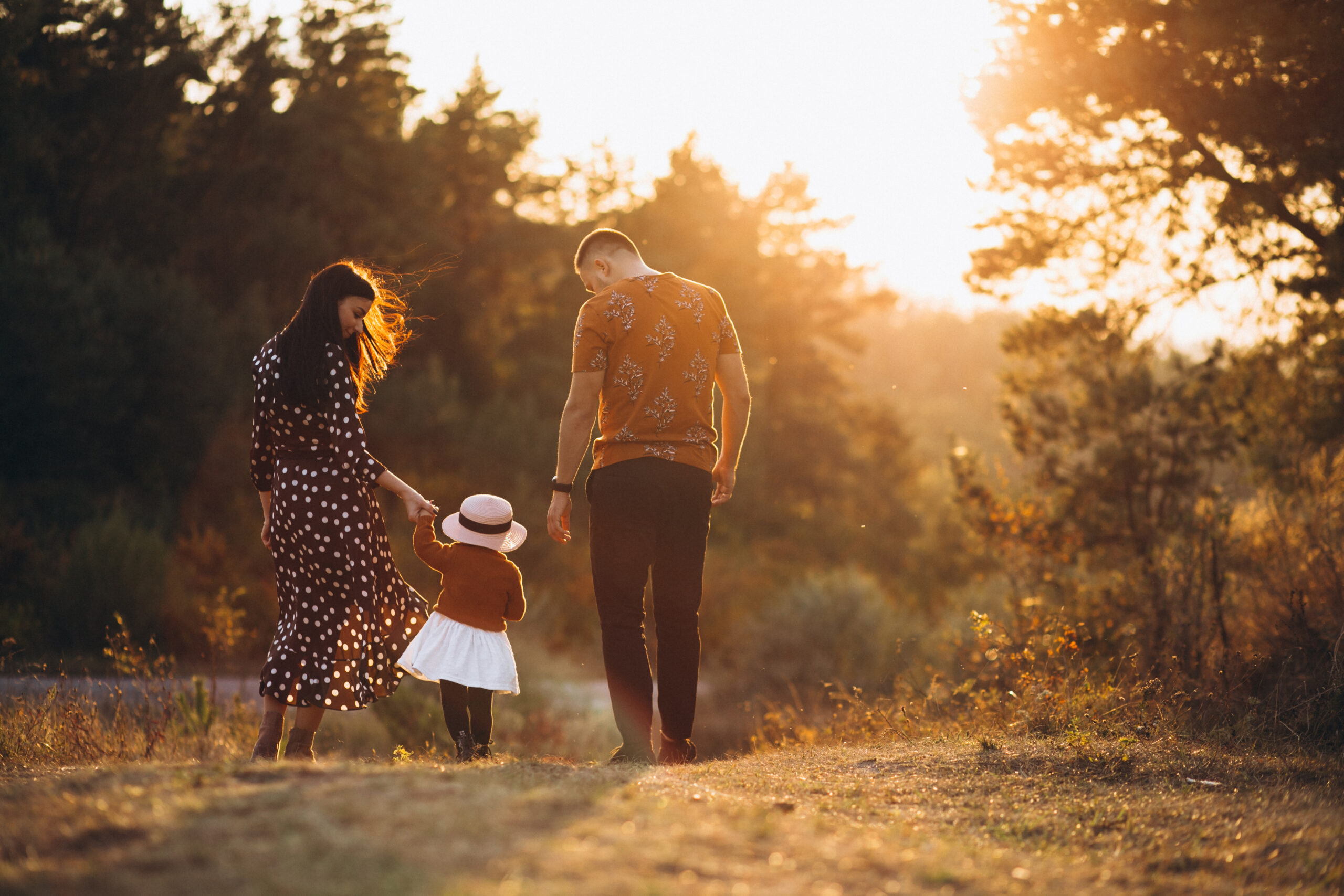 mom dad daughter family in autumn